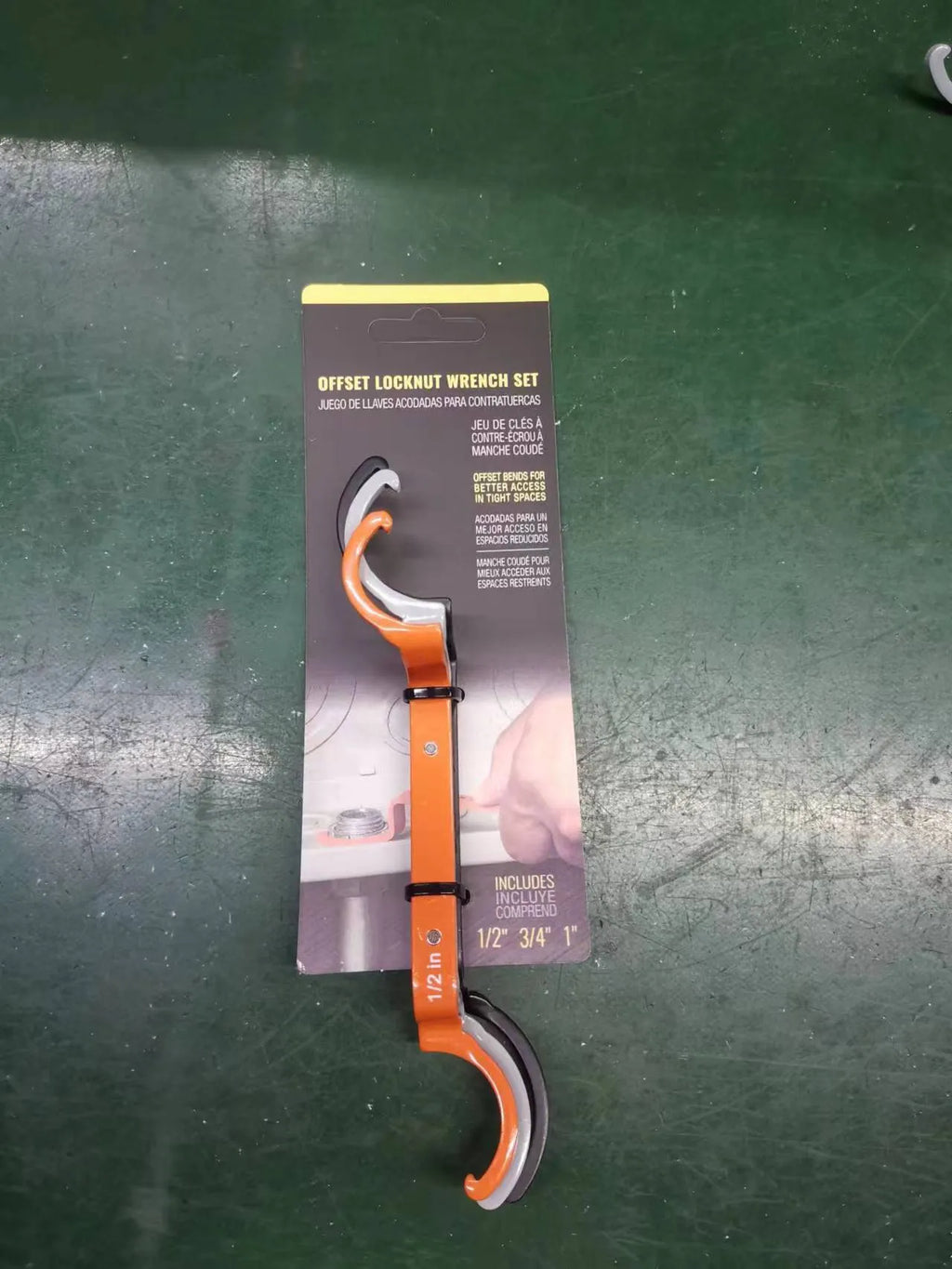Three colour-coded crescent wrenches with magnetic suction bases: orange, grey and black adjustable spanners