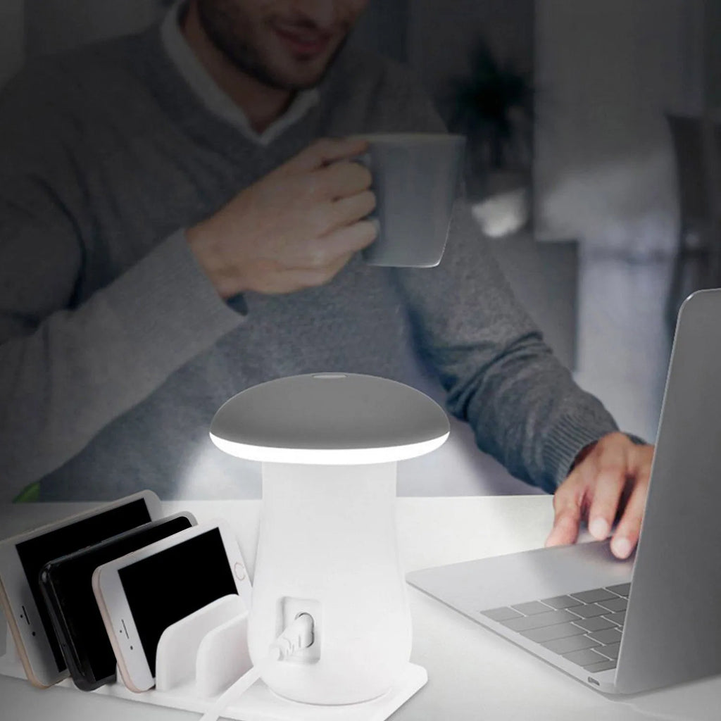 White mushroom-shaped USB charging dock station with five ports and a built-in LED night lamp on a desk.