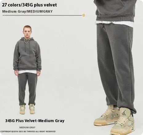 Men's solid colour cotton velvet casual sweatpants with elasticated waist and ankle cuffs.