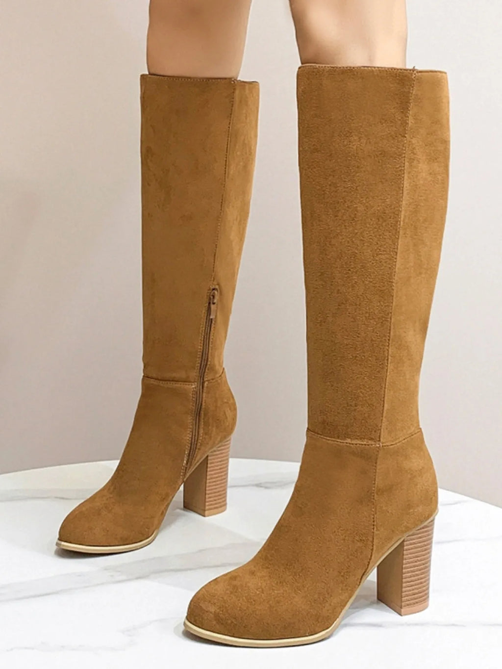 Women's black square toe high heel fashion boots made from synthetic PU material.