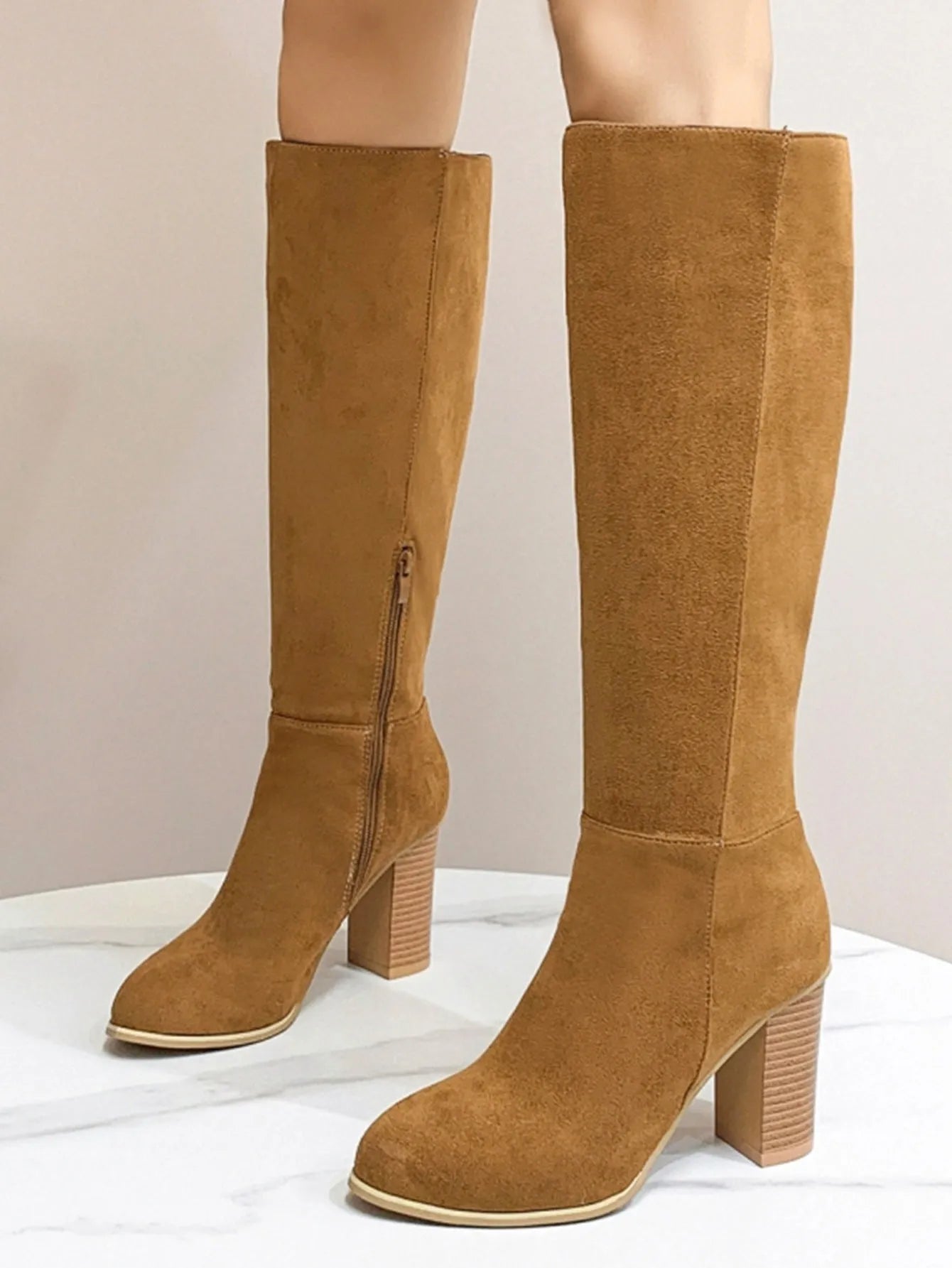 Women's black square toe high heel fashion boots made from synthetic PU material.