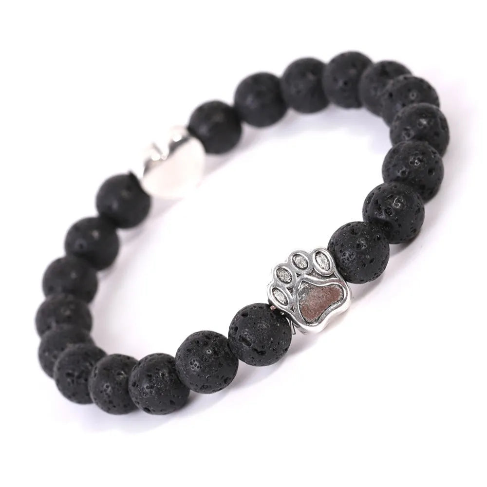 Tigereye Indian Agate stone bracelet with dog paw and love heart charms on wrist.