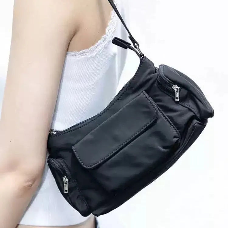 Black PU leather women's shoulder bag with double pockets and side line detail.