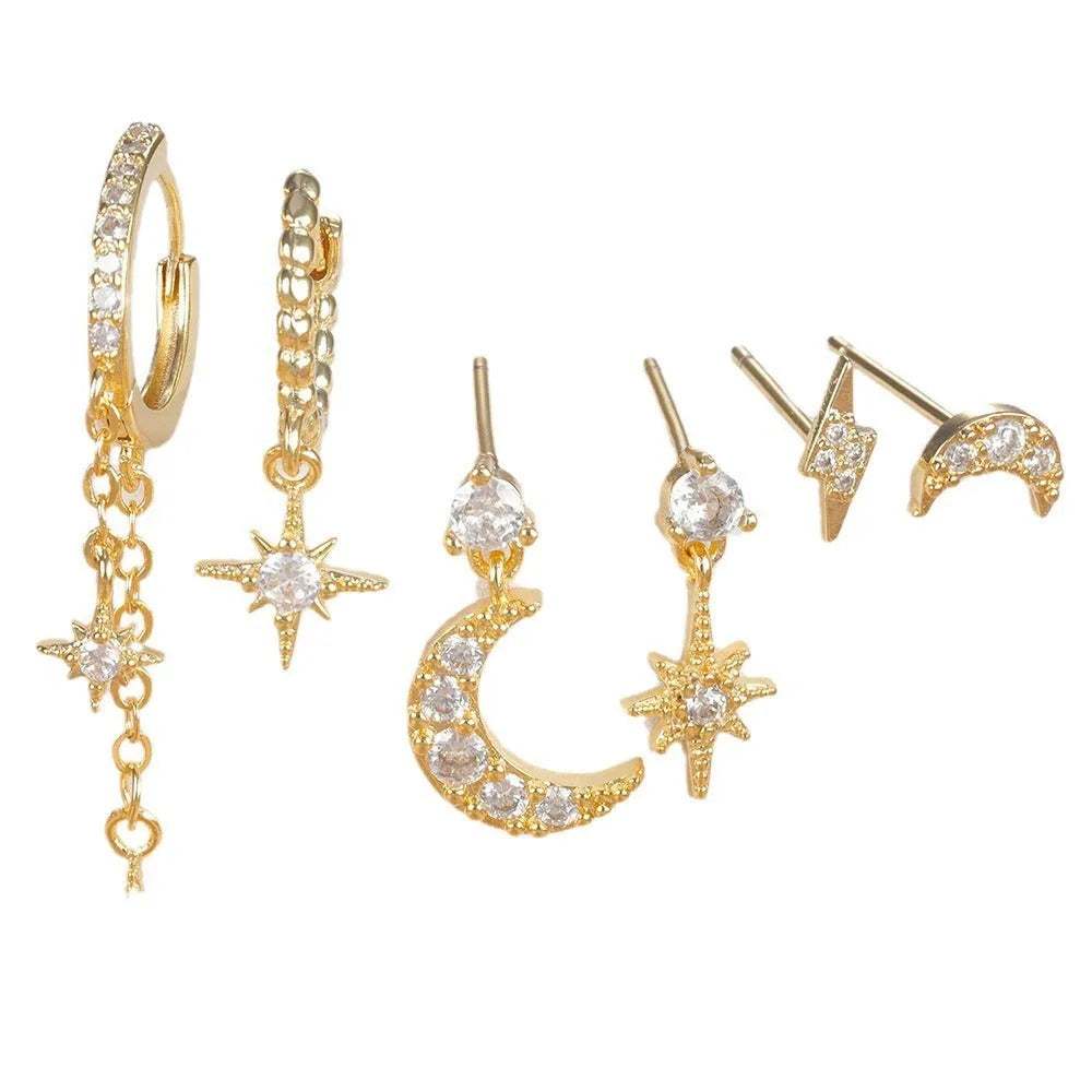 Set of six gold-coloured women's earrings with chain tassel designs and zircon studs on a white background.