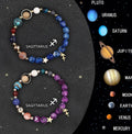 Set of twelve natural stone beaded bracelets showing different zodiac sign designs on elastic cords