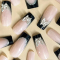 Black French style false nails with butterfly pattern and glittering finish, medium length