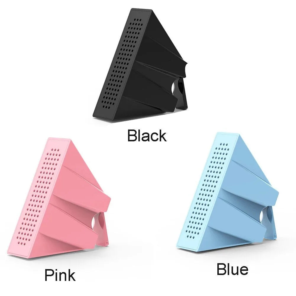 Mini mobile phone amplifier bracket on desktop enhancing smartphone sound in black, blue, pink or orange
