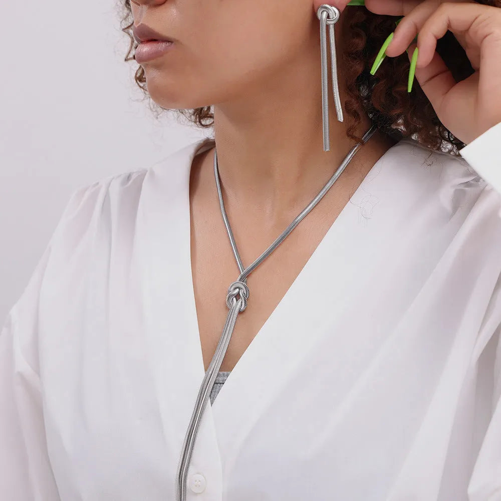 Gold electroplated titanium steel knotted tassel necklace with snake chain and matching earrings set