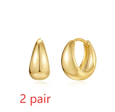 Geometric brass diamond earclip earrings with round accents in golden electroplated finish