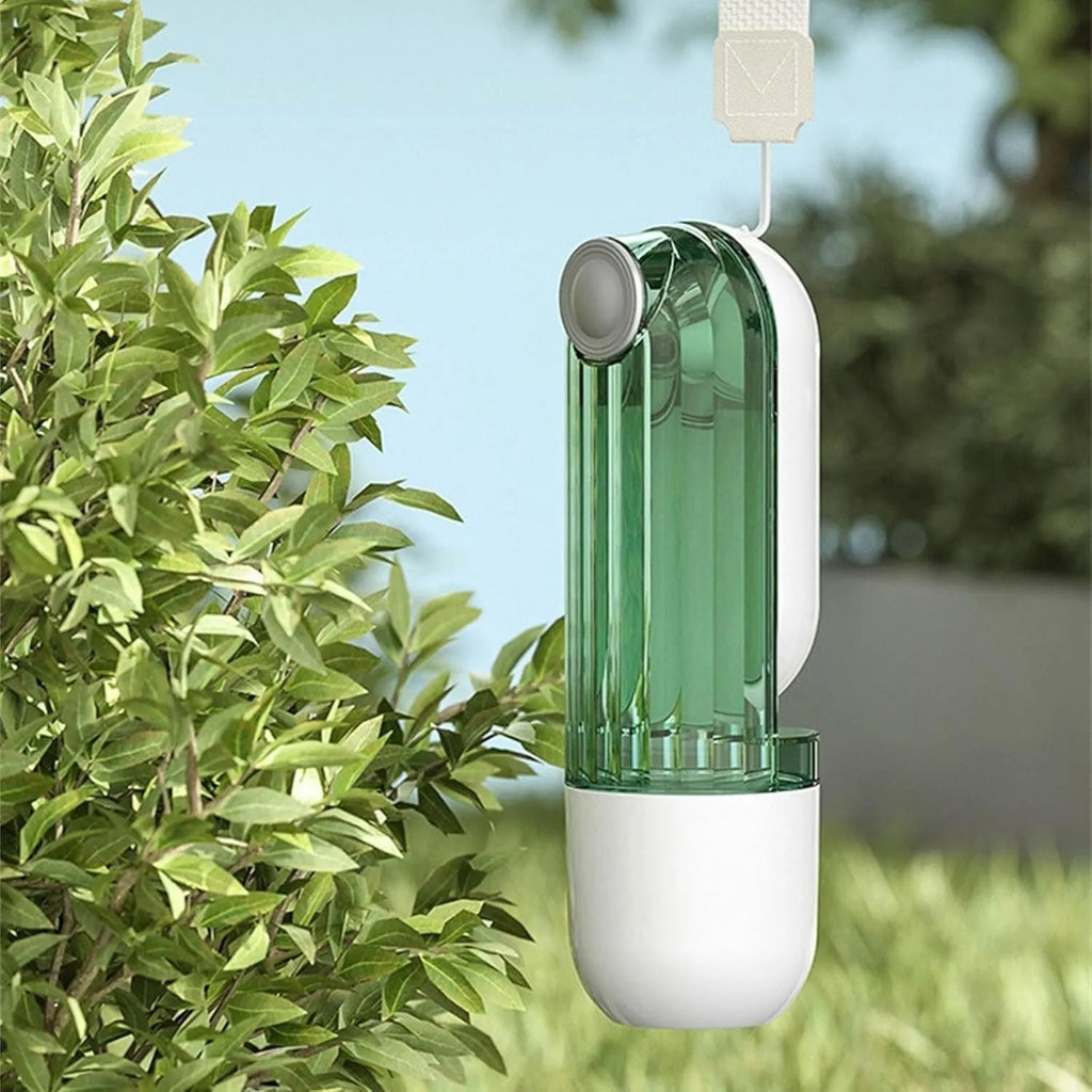 Beige and green foldable dog water bottle with food dispenser for outdoor use