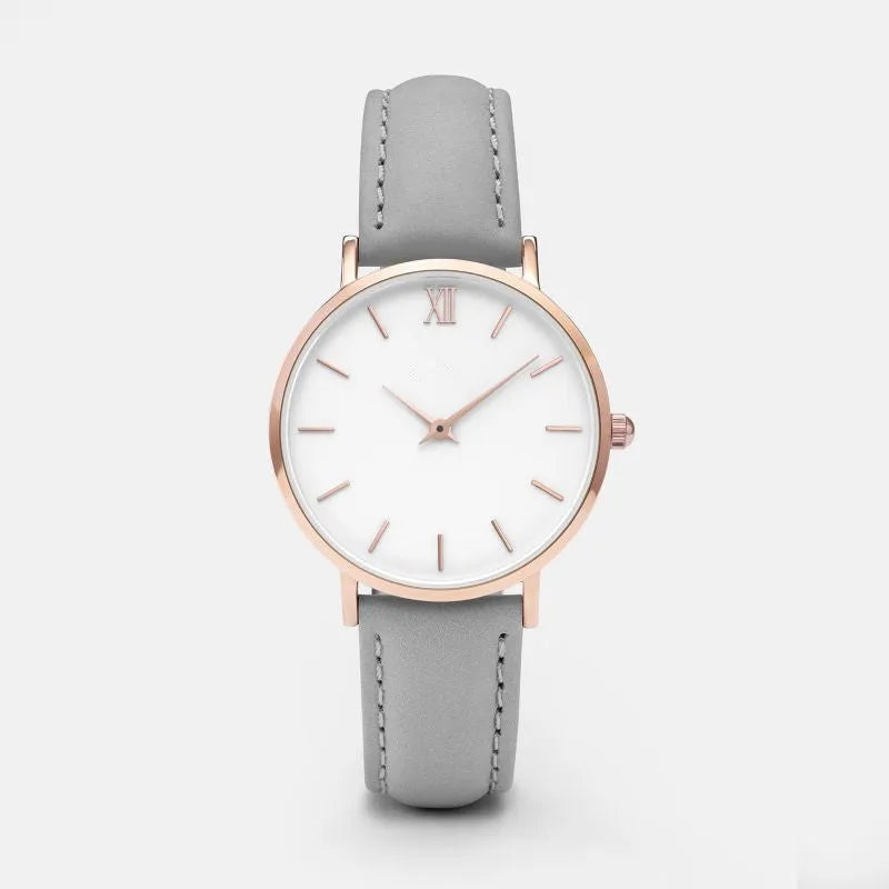 Square-faced quartz watch with an alloy case and PU leather strap on a wrist.