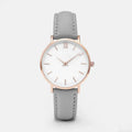 Square-faced quartz watch with an alloy case and PU leather strap on a wrist.
