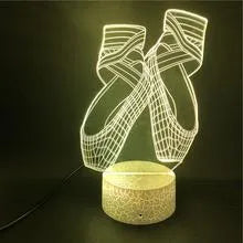 3D ballet dancer silhouette LED night light glowing in purple on a black base with remote control.