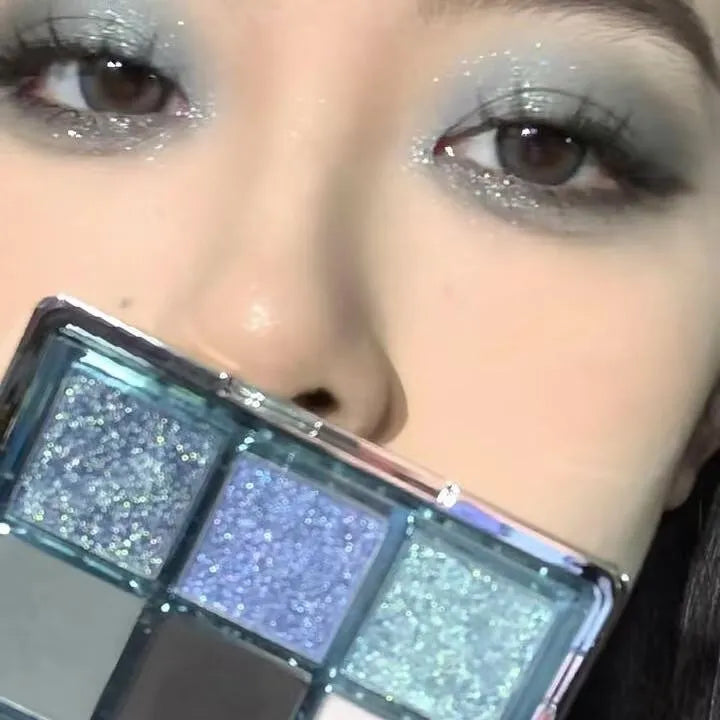 MUGELEEN nine-colour eye shadow palette showing blue smoked and earth tone shades
