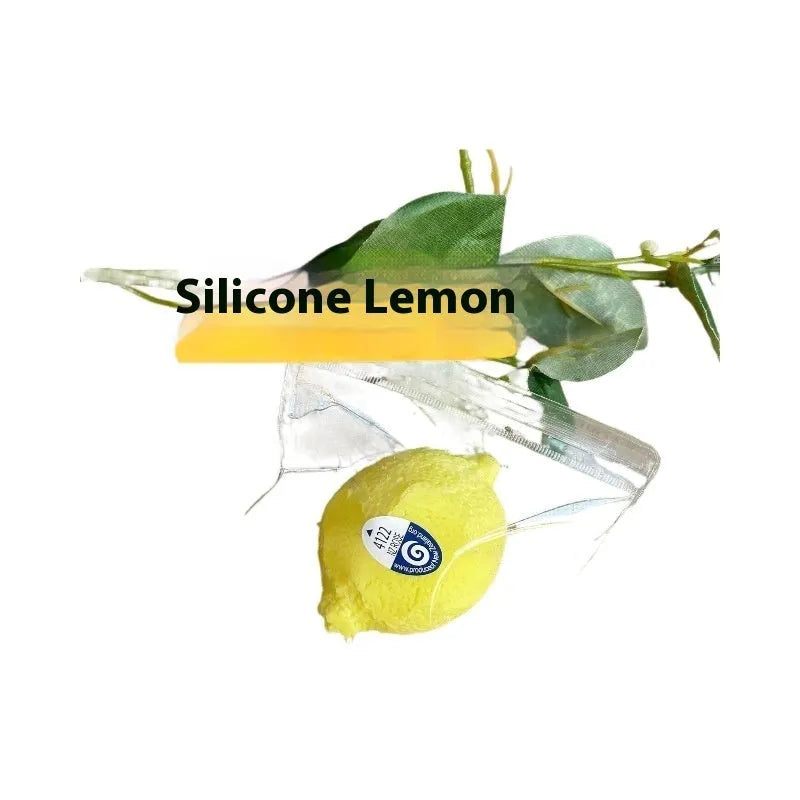 Yellow silicone lemon squeezing toy on a flat surface used for stress relief and sensory play