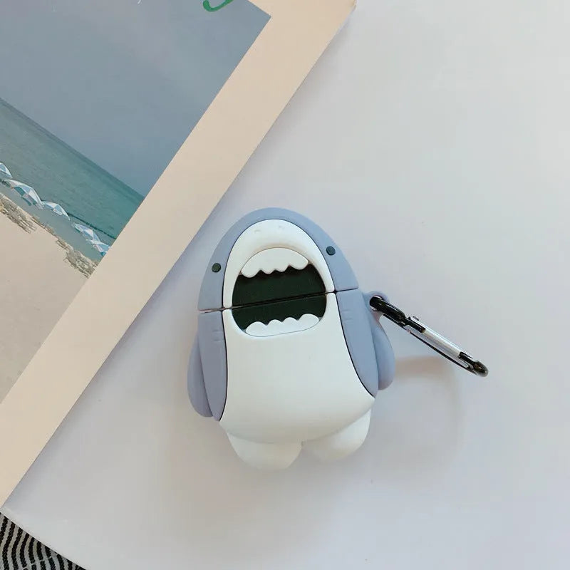 Silicone protective cover for Apple AirPods 1 and 2 charging case with clip-on shark fin decoration.