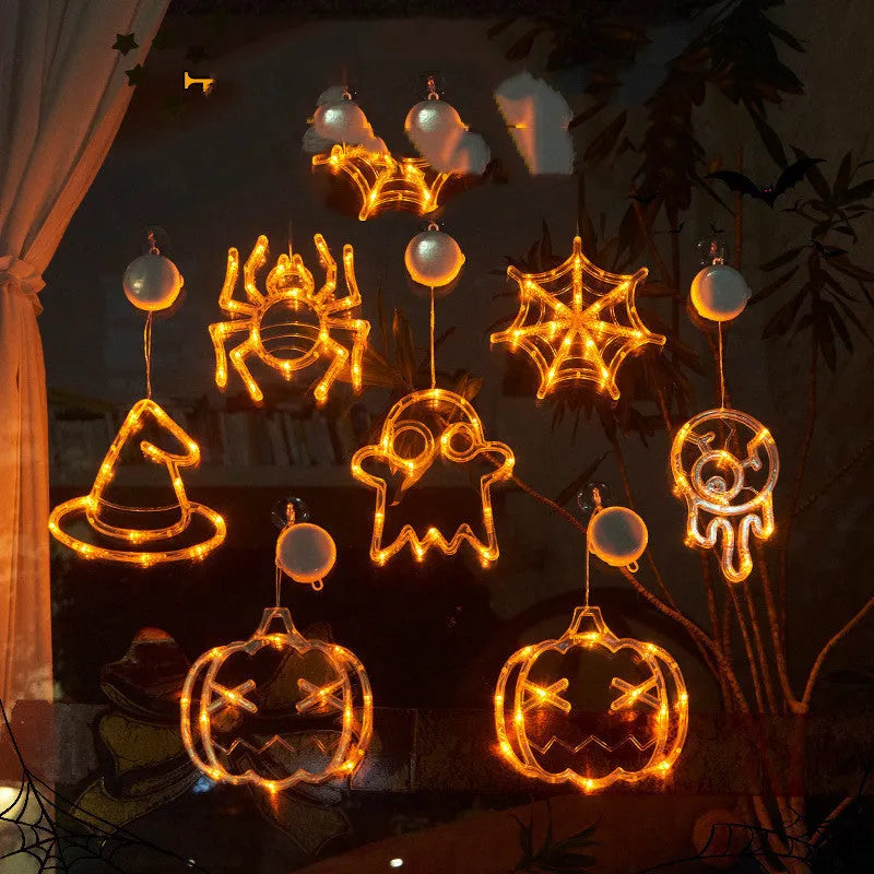 Halloween window hanging LED lights with seven designs including spider, pumpkin, ghost, and bat motifs