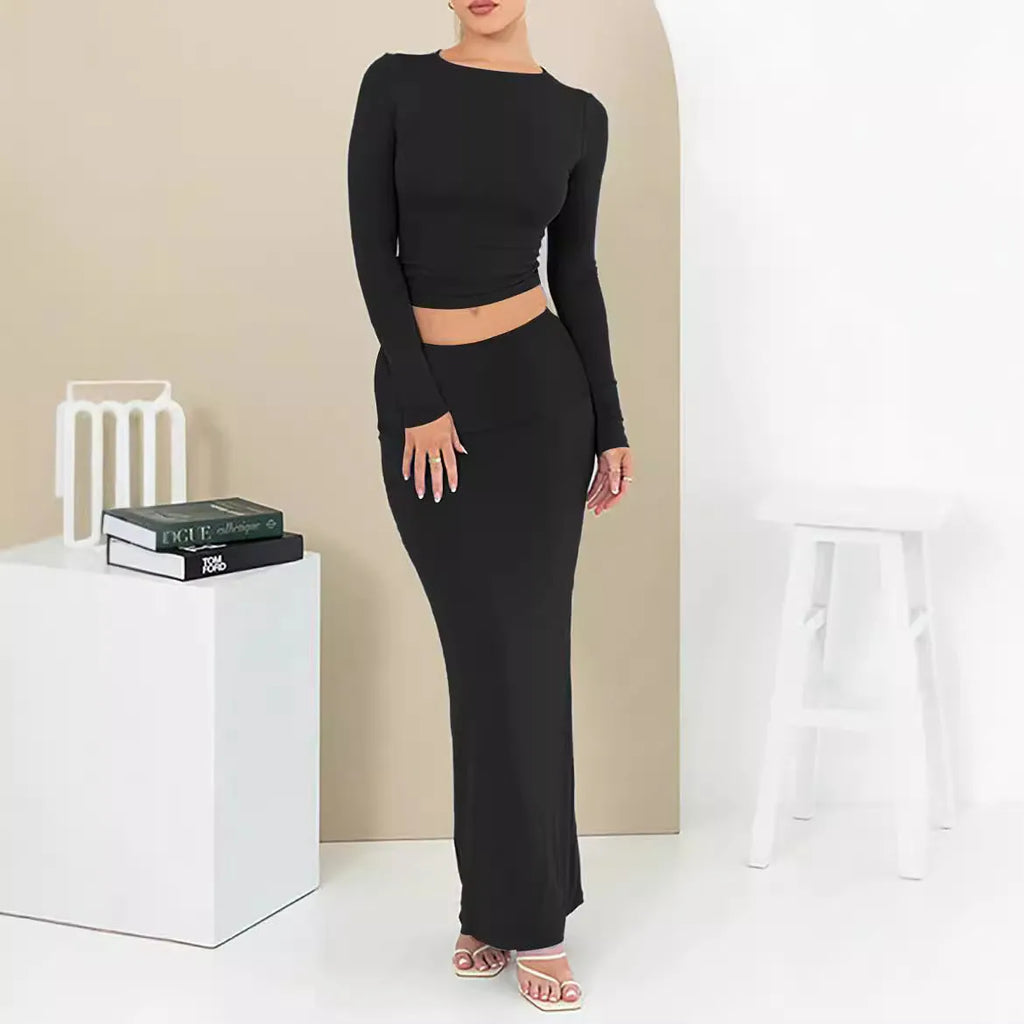 Women's black sweet style polyester two-piece suit with exposed navel and three-quarter sleeves.