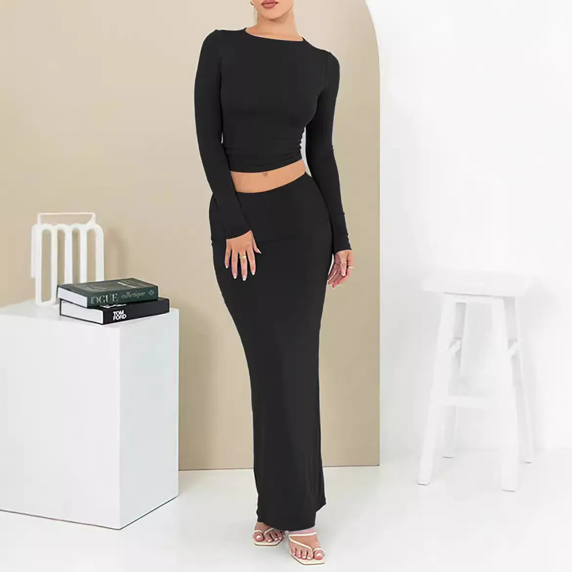 Women's black sweet style polyester two-piece suit with exposed navel and three-quarter sleeves.