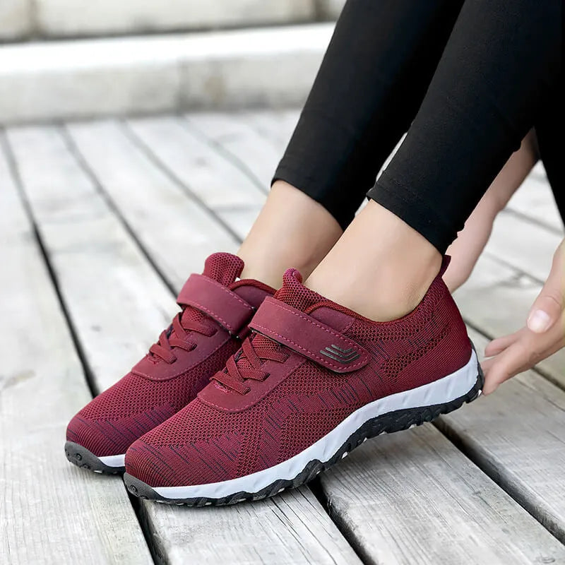 Women's low-top grey purple wedge heel shoes with velcro strap and breathable mesh upper.