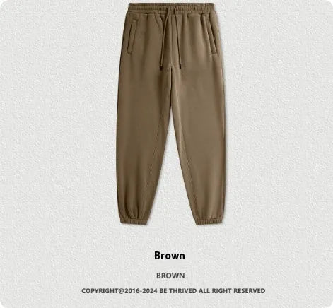 Men's solid colour cotton velvet casual sweatpants with elasticated waist and ankle cuffs.