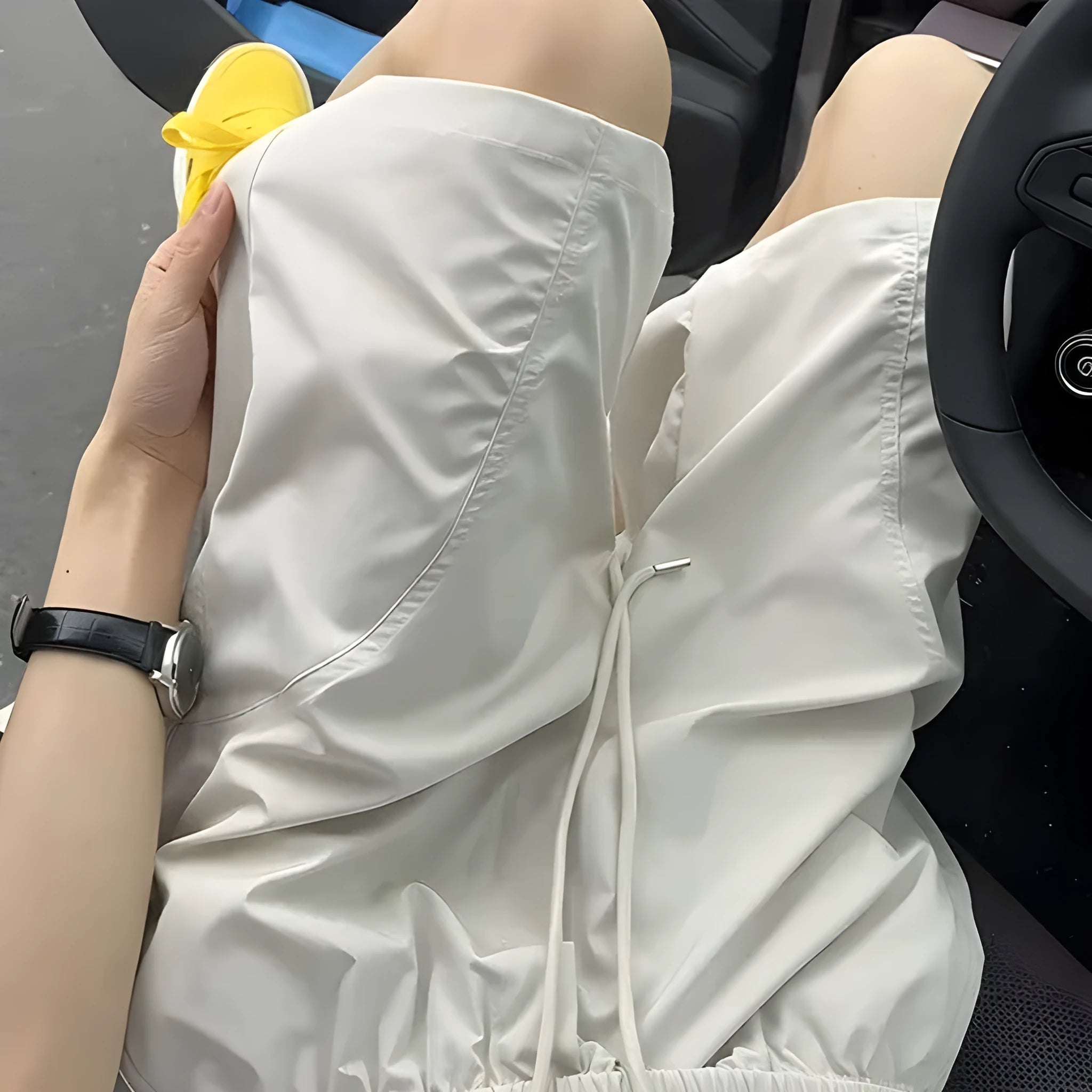 Men's creamy-white polyester sports shorts with elastic waistband and straight cut design