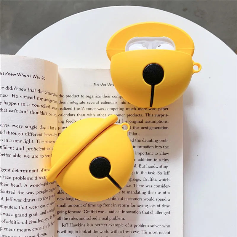 Bright yellow bell-shaped silicone protective case for Apple AirPods 1 and 2 with a carrying hook.
