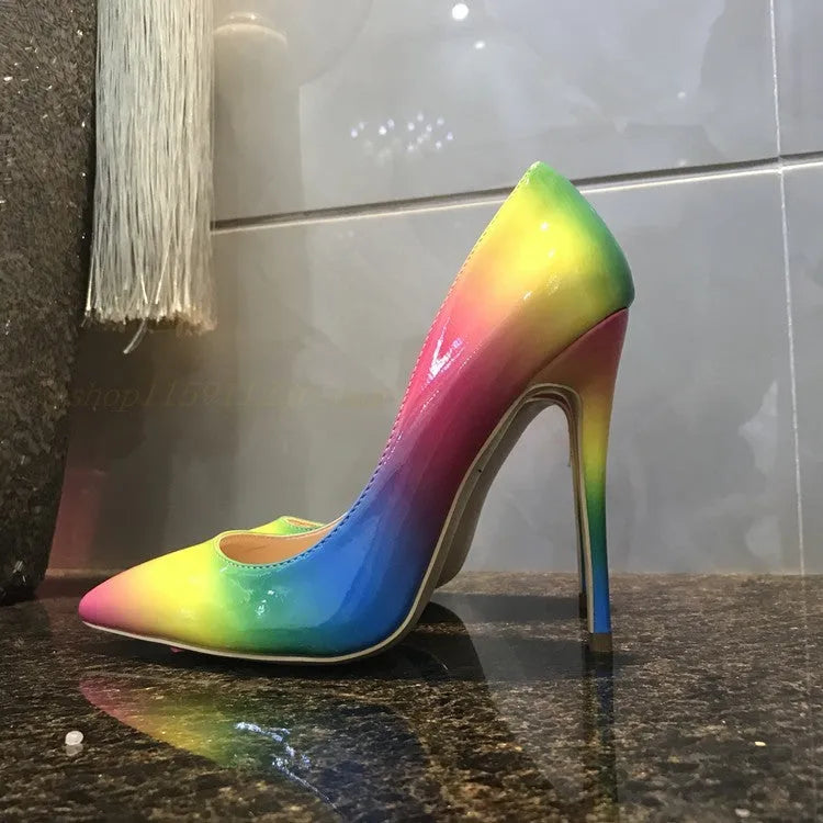 Rainbow coloured patent leather women's high heel shoe with pointed toe and thin high heel.
