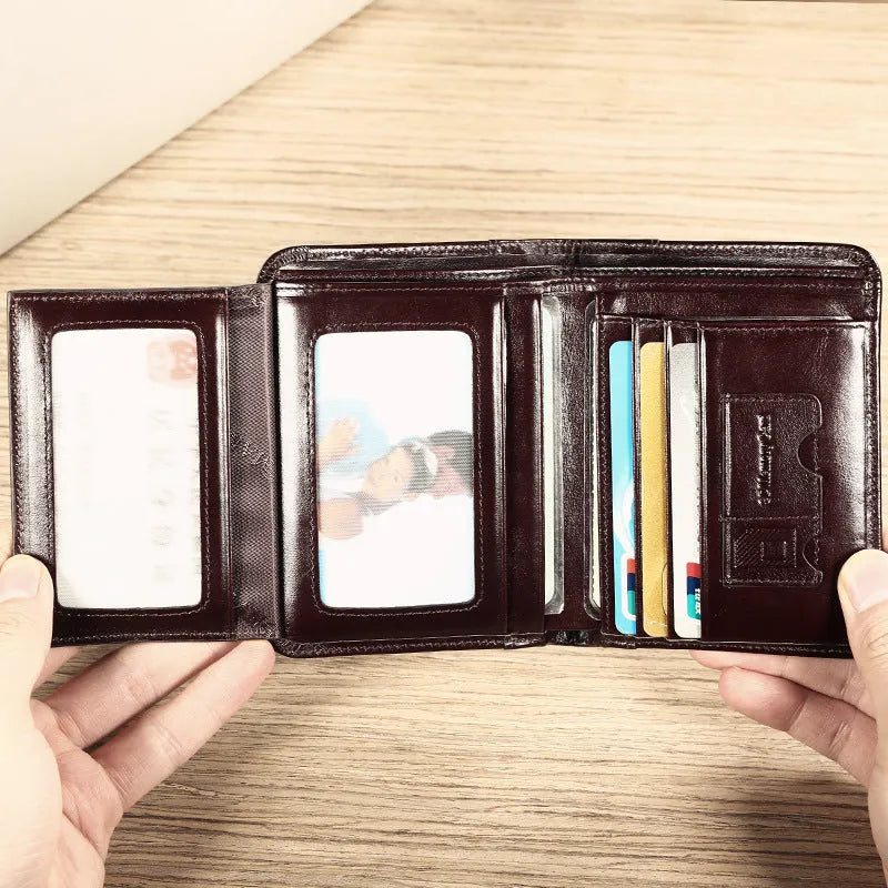 Men's leather wallet showing multiple internal compartments including card slots, coin pocket and photo window