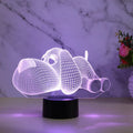 Dog-shaped desktop lamp glowing in blue with touch button and USB power cable