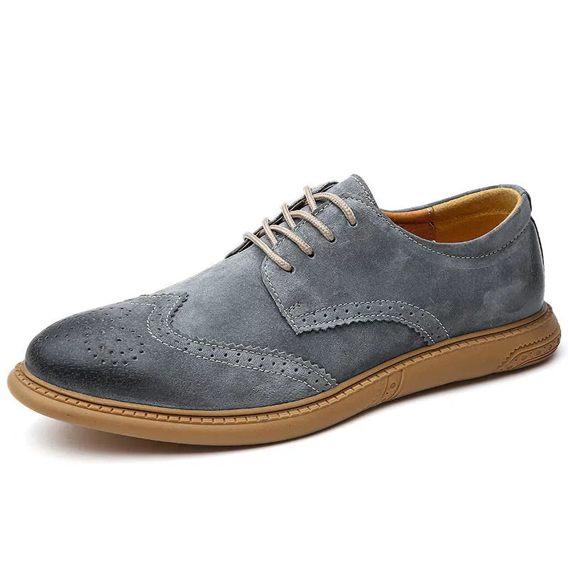 Men's black genuine cowhide business lace-up shoes with leather toe cap on a grey background.