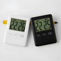 Black and white kitchen timer with digital display and magnetic back