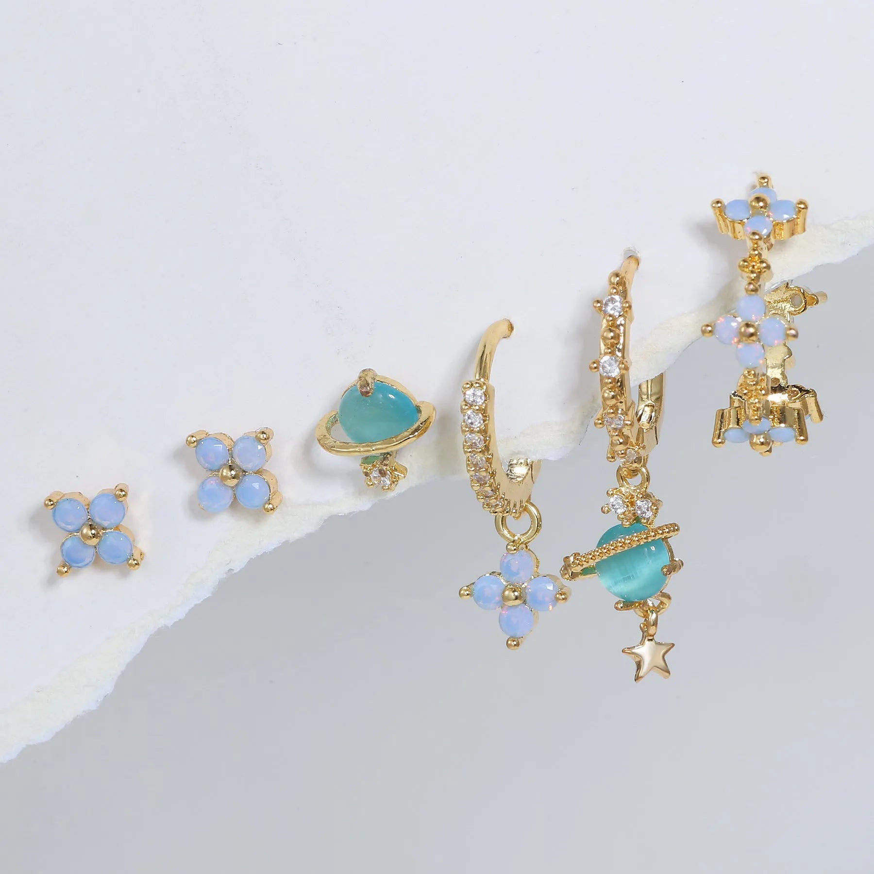 Blue protein flower nail ear studs with zircon mosaic details in gold or silver colour