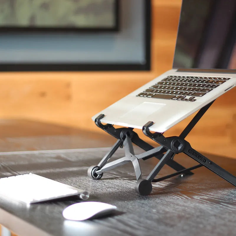 Black folding portable laptop stand made from reinforced nylon, shown in open and closed positions.
