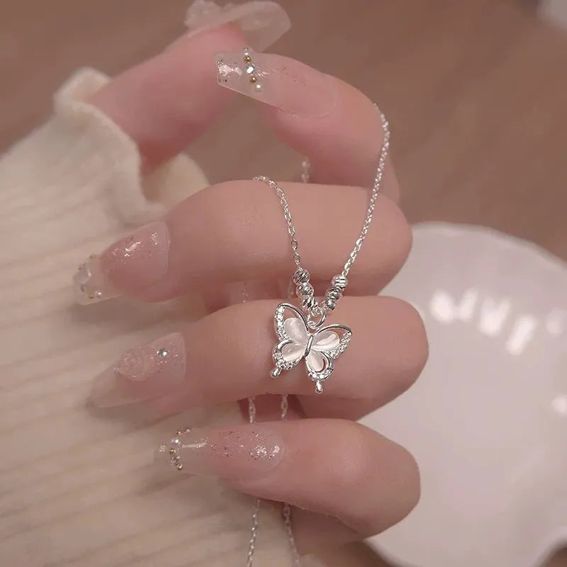 Silver butterfly pendant necklace on adjustable 41-50cm chain with cross link detail