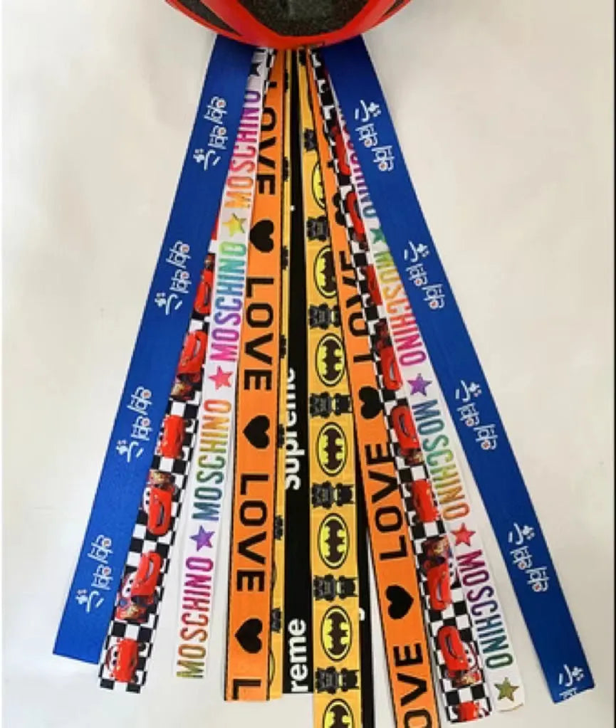 Children's decorative helmet streamer ribbon in multiple colours for roller skating and skiing safety gear.