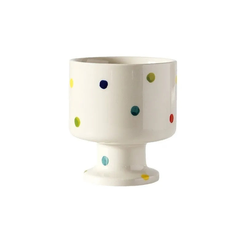Hand-pinched irregular ceramic mug in solid colour with modern simple style, shown from side angle