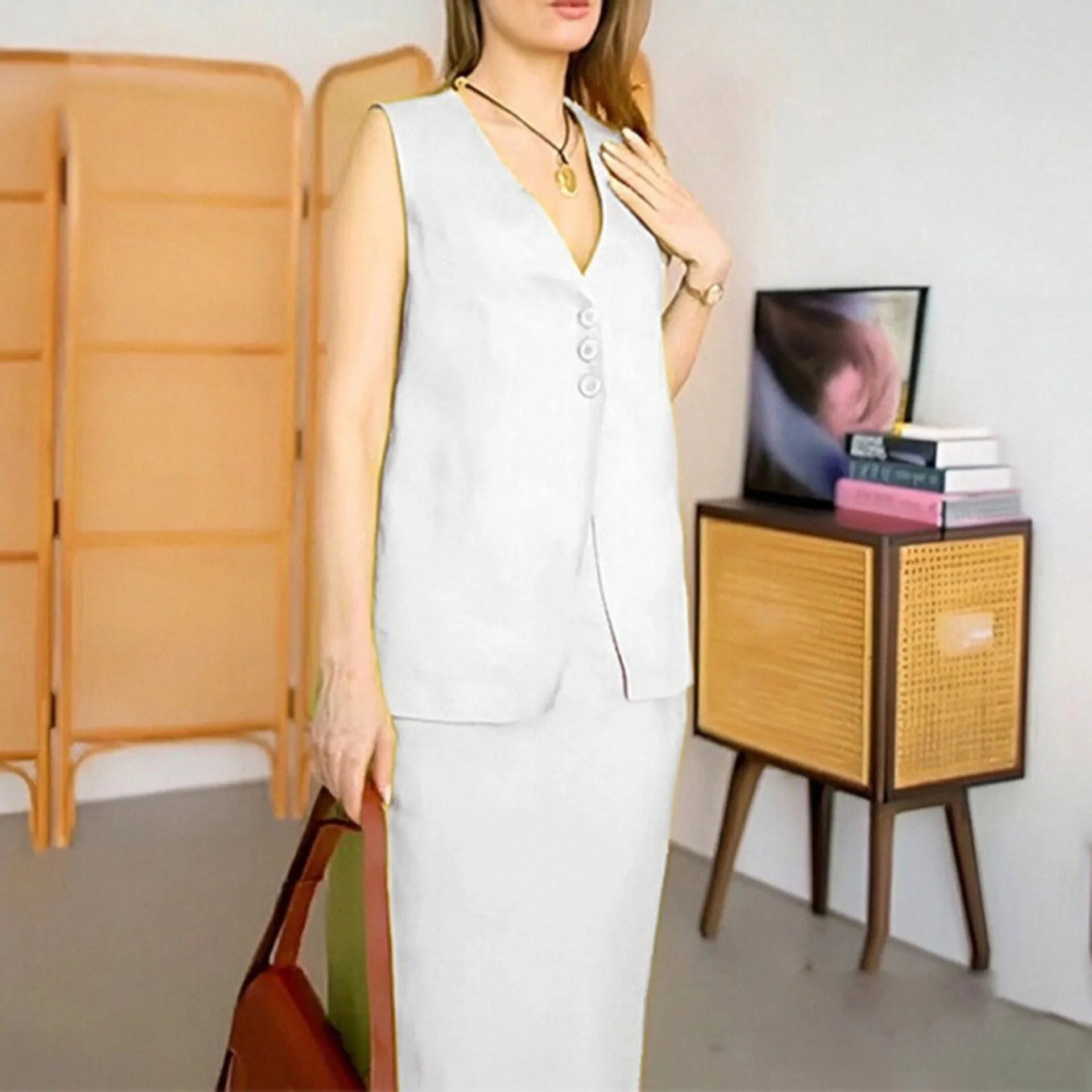Blue women's two-piece lounge set with sleeveless top and long skirt on a hanger