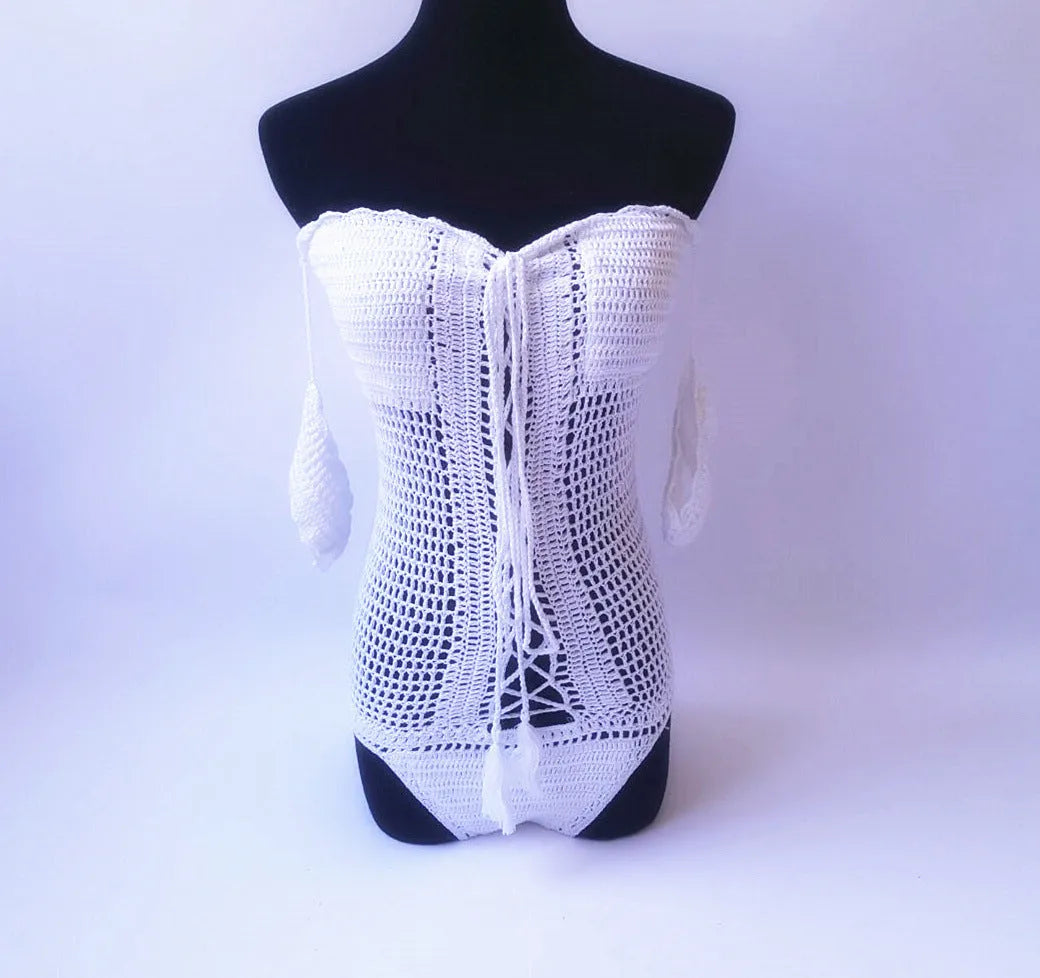 Off-shoulder one-piece swimsuit on a mannequin in light pink colour.