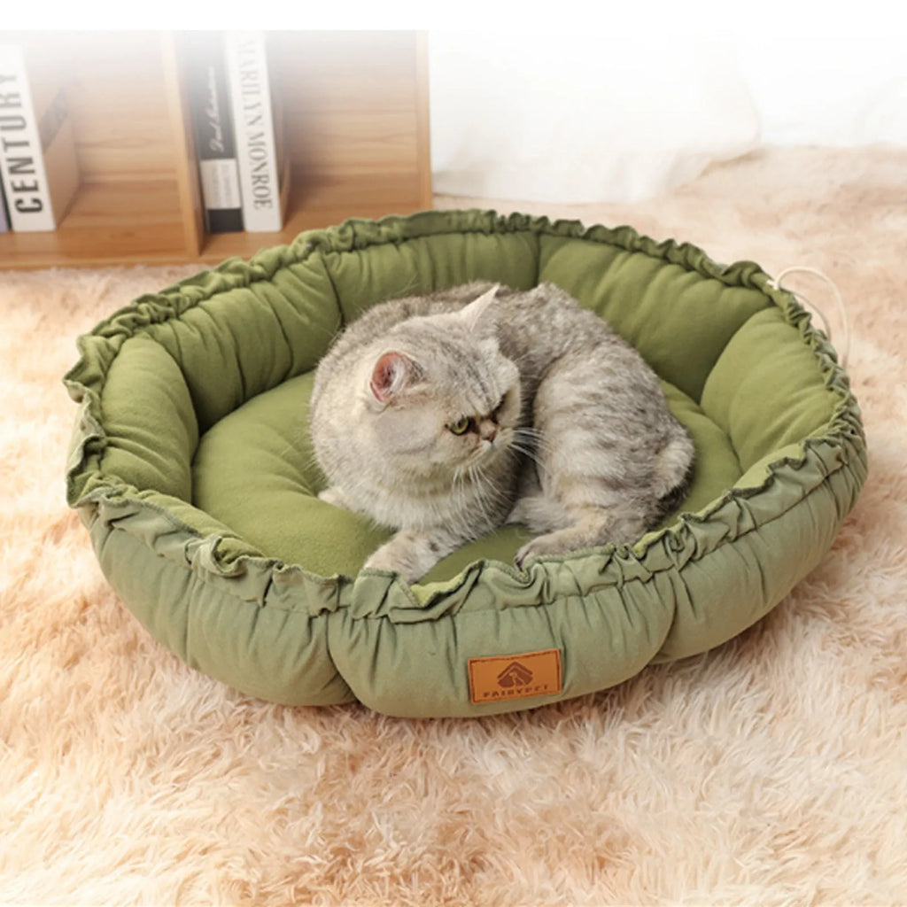 Grey and green reversible donut-shaped cat bed with plush fabric and non-slip base