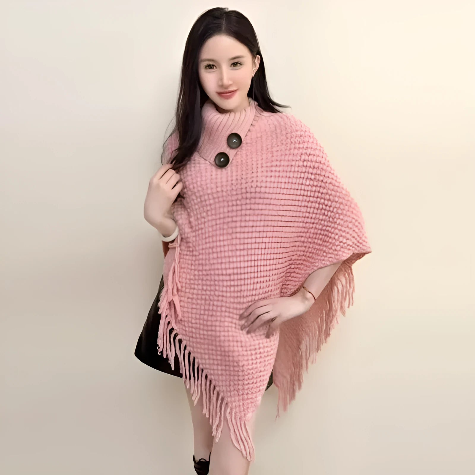 Women's triangular plush shawl cape with tassels in a cashmere and acrylic blend fabric.