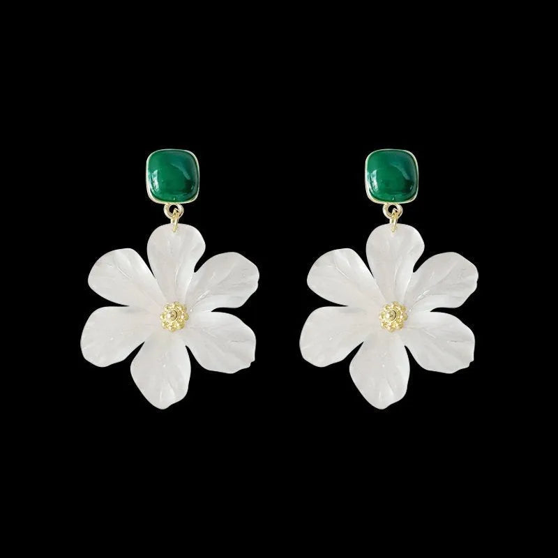 A pair of dark green alloy earrings with a detailed needle flowers sweet floral design.