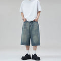 Men's light blue cotton denim shorts with a straight leg and cropped length on a hanger