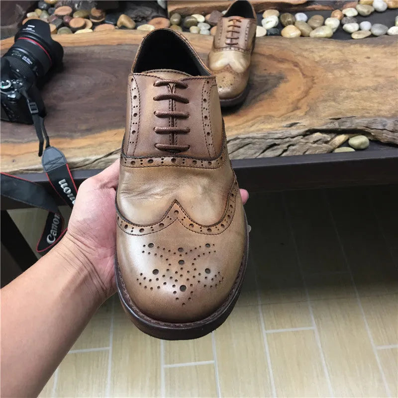 Men's light brown leather shoes with engraved distressed detailing and lace-up closure