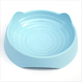Blue ceramic dog slow feeder bowl with raised maze cups for fast-eating puppies