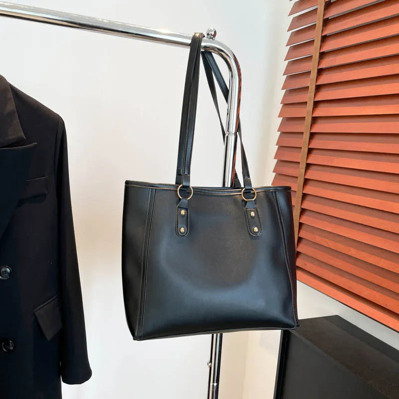 Korean style shoulder underarm bag in black PU leather with horizontal square shape and sandwich pockets