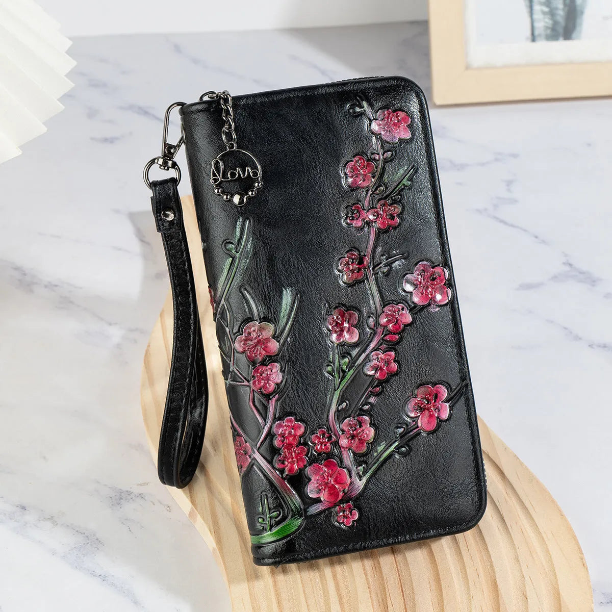 Embossed floral pattern Chinese style handbag with zipper closure in black colour