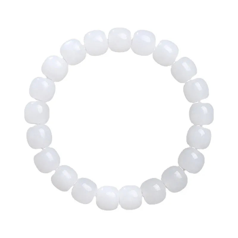 White Hetian jade barrel bead bracelet for men and women on a plain background.