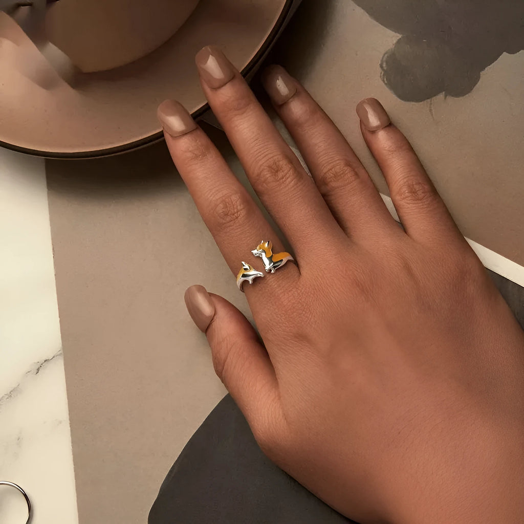 Silver ring with a raised cartoon corgi dog design, electroplated finish.