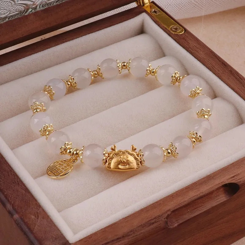 Floral glazed zodiac bracelet with glass beads and coloured glaze animal charm